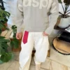 Crew Neck Sweater with Patch – Sweaters and Cardigans